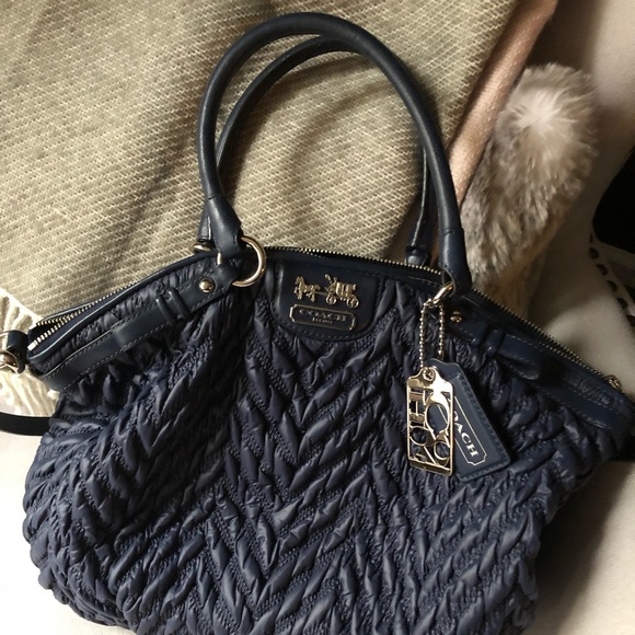 Navy Coach large crossbody satchel.